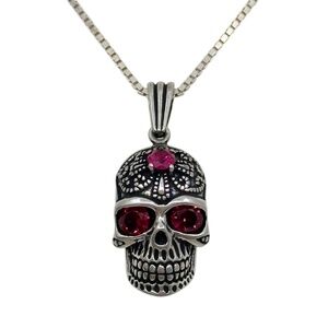 Sterling silver ruby skull pendant
